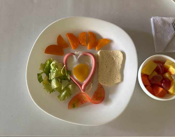 Breakfast at Cuyabeno Kichwa Lodge includes eggs, cheese, meat, vegetables, and more.